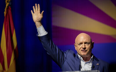 Sen. Mark Kelly, D-Ariz., waves supporters goodnight during an election night event in Tucson, Ariz., Tuesday, Nov. 8, 2022. (AP/Alberto Mariani)