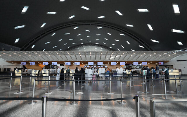 Passengers walk at Hamad International Airport in Doha, Qatar, November 10, 2022. (AP Photo/Hassan Ammar)