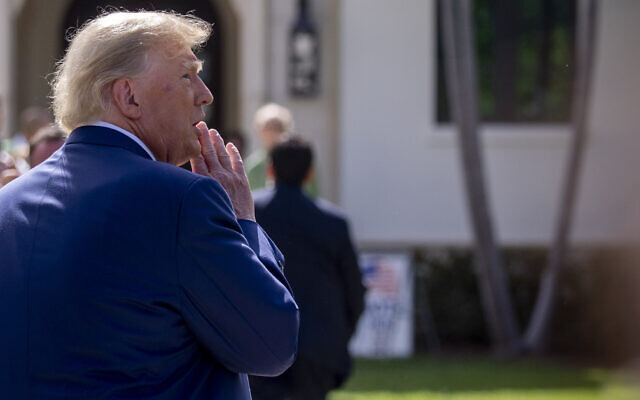 Former US president Donald Trump speaks to members of the media outside Morton and Barbara Mandel Recreation Center after voting on Election Day, November 8, 2022, in Palm Beach, Florida. (AP Photo/Andrew Harnik)