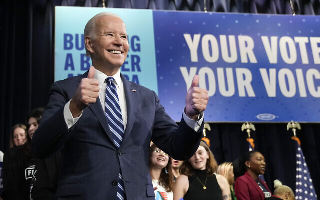 US President Joe Biden gestures to the crowd as he leaves after speaks at Howard Theatre in Washington, November 10, 2022. (AP Photo/Andrew Harnik)