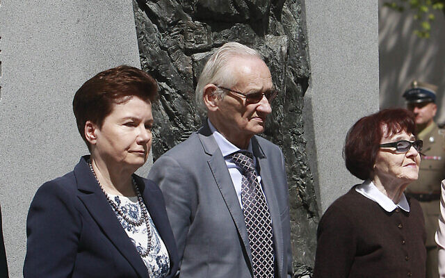 Warsaw Mayor Hanna Gronkiewicz-Waltz, left, with Andrzej Pilecki, center, and Zofia Pilecka-Obtulowicz, right, after they unveiled a monument to Capt. Witold Pilecki, in Warsaw, Poland, Saturday, May 13, 2017. The son of World War II Auschwitz death camp hero Witold Pilecki is seeking millions in compensation from Poland's government for his father's post-war arrest and his 1948 execution by the communist authorities of the time.  (AP/Czarek Sokolowski, File)