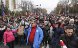 People chant slogans during a protest in Chisinau, Moldova, Nov. 13, 2022. (AP Photo/Aurel Obreja)