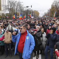 People chant slogans during a protest in Chisinau, Moldova, Nov. 13, 2022. (AP Photo/Aurel Obreja)