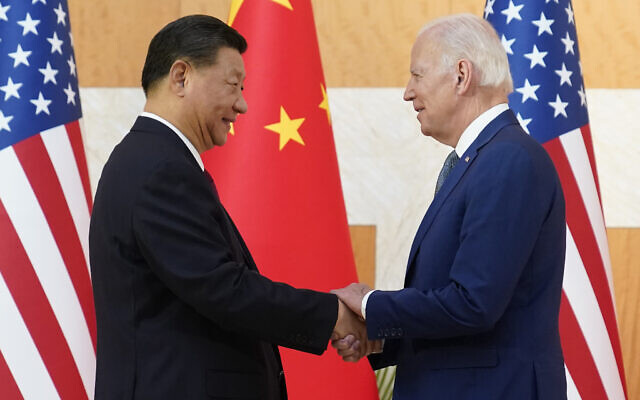 US President Joe Biden, right, and Chinese President Xi Jinping shake hands before their meeting on the sidelines of the G20 summit meeting, November 14, 2022, in Nusa Dua, in Bali, Indonesia. (AP Photo/Alex Brandon)