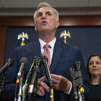 House Minority Leader Kevin McCarthy, of Calif., talks the media, Tuesday, Nov. 15, 2022, after voting on top House Republican leadership positions, on Capitol Hill in Washington. Rep. Elise Stefanik, R-N.Y., is at right. (AP/Jacquelyn Martin)