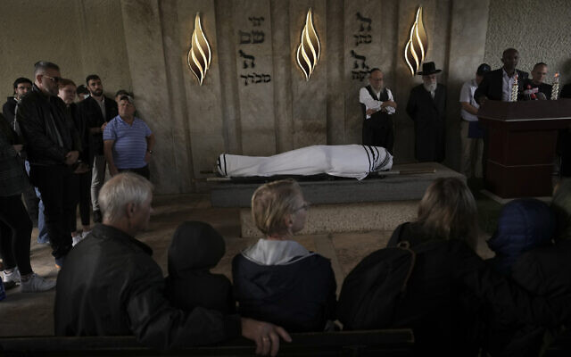Mourners attend the funeral of Michael Ladygin in Bat Yam on November 16, 2022. (AP Photo/Oded Balilty)