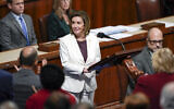 House Speaker Nancy Pelosi of California, acknowledges applause from lawmakers after speaking on the House floor at the Capitol in Washington, November 17, 2022. (AP Photo/Carolyn Kaster)
