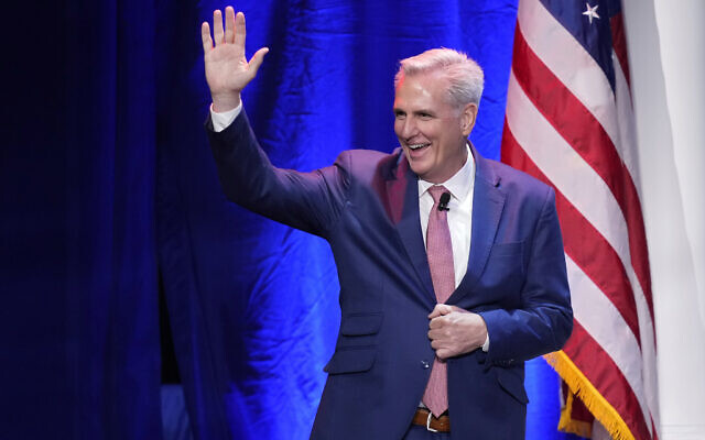 House Minority Leader Kevin McCarthy waves as he walks on stage before speaking at an annual leadership meeting of the Republican Jewish Coalition, Nov. 19, 2022, in Las Vegas. (AP Photo/John Locher)
