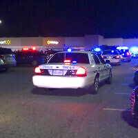 In this image from video Virginia police respond to the scene of a fatal shooting at a Walmart in Chesapeake, Virginia, November 22, 2022. (WAVY-TV 10 via AP)