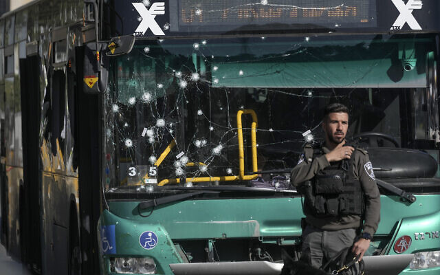 Israeli police inspect the scene of an explosion at a bus stop in Jerusalem, November 23, 2022. (AP Photo/Mahmoud Illean)
