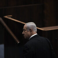Incoming prime minister Benjamin Netanyahu seen at the Knesset ahead of the vote on a bill to dissolve parliament, in Jerusalem, June 30, 2022. (AP Photo/Ariel Schalit, File)