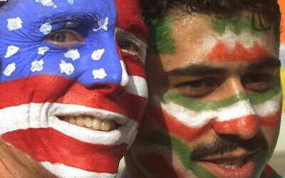 Mike Moscrop, left, from Orange County, Calif., poses with Amir Sieidoust, an Iranian supporter living in Holland outside the Gerlain Stadium in Lyon, June 21, 1998, before the start of the USA vs Iran World Cup soccer match. (AP Photo/Jerome Delay)