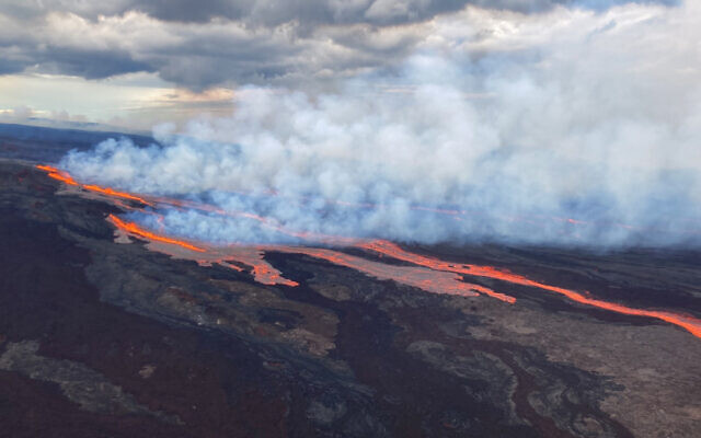 In this aerial photo released by the U.S. Geological Survey, the Mauna Loa volcano is seen erupting from vents on the Northeast Rift Zone on the Big Island of Hawaii, Monday, Nov. 28, 2022. (U.S. Geological Survey via AP)
