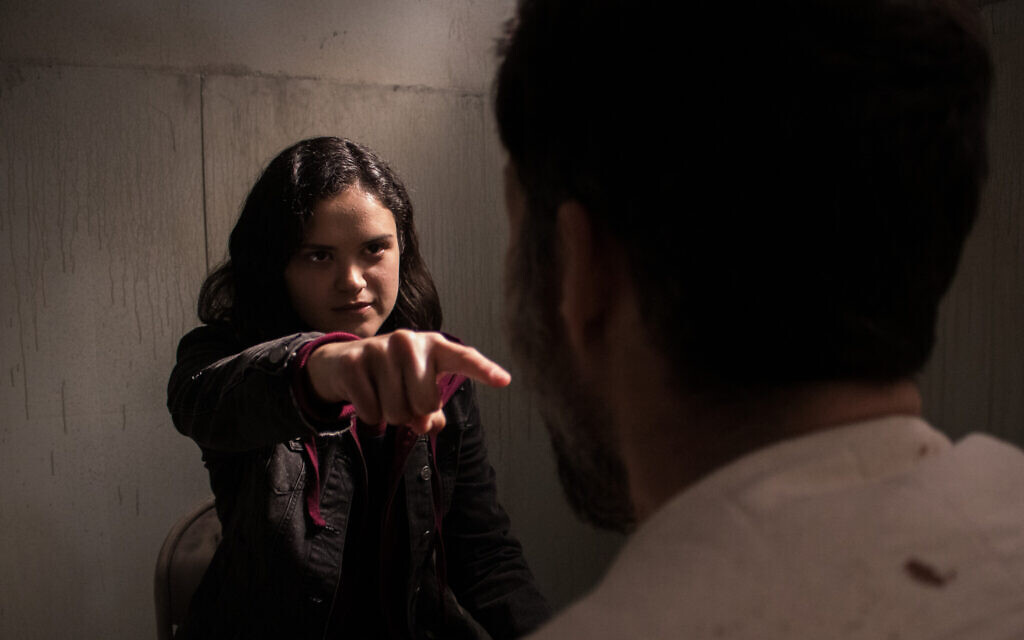 Victoria Moroles in an intense yet humorous scene with Josh Ruben in 'Blood Relatives.' (Shudder)
