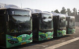 A line of Egged electric buses seen at their charging station in Jerusalem during the launching ceremony, on September 3, 2019. (Hadas Parush/Flash90)