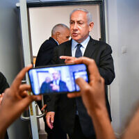 Opposition leader Benjamin Netanyahu arrives for a court hearing for a lawsuit against former prime minister Ehud Olmert, at the Tel Aviv Magistrate's Court on June 12, 2022. (Avshalom Sassoni/Flash90)