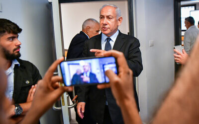 Opposition leader Benjamin Netanyahu arrives for a court hearing for a lawsuit against former prime minister Ehud Olmert, at the Tel Aviv Magistrate's Court on June 12, 2022. (Avshalom Sassoni/Flash90)