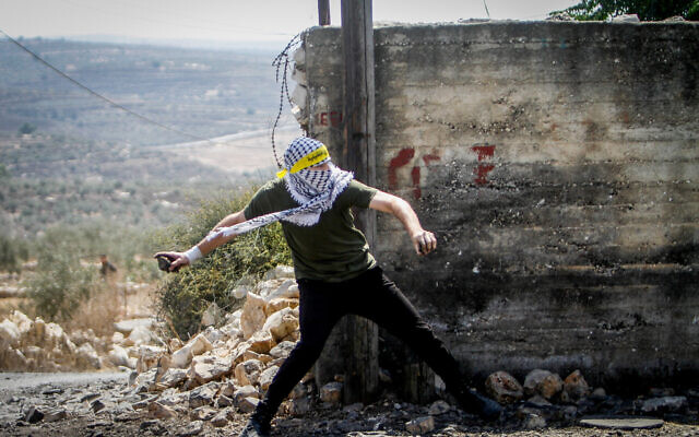 Illustrative: Palestinians clash with Israeli security forces during a protest in the village of Kfar Qaddum, near the West Bank city of Nablus, September 23, 2022. (Nasser Ishtayeh/Flash90)