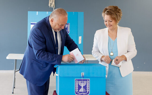 Yisrael Beytenu's Avigdor Liberman and his wife cast their votes at a voting station in the West Bank settlement of Nokdim, November 1, 2022 (Gershon Elinson/Flash90)