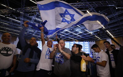 Likud party supporters celebrate at the party headquarters on election night, November 1, 2022. (Olivier Fitoussi/Flash90)