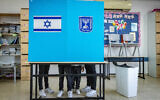 Israelis cast their ballots in the Israeli general elections, at a voting station in Jerusalem,on November 1, 2022. (Olivier Fitoussi/Flash90)