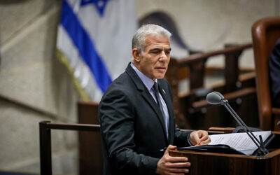 Prime Minister Yair Lapid speaks in the plenum hall of the Knesset, in Jerusalem on November 6, 2022. (Noam Revkin Fenton/Flash90)