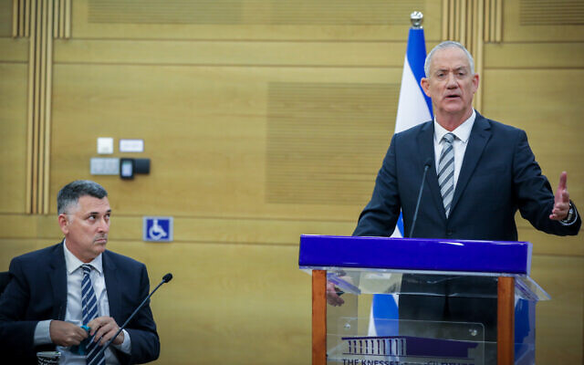 Then-outgoing defense minister Benny Gantz and then-justice minister Gideon Sa'ar (R) at a National Unity faction meeting at the Knesset, on November 6, 2022. (Noam Revkin Fenton/Flash90)