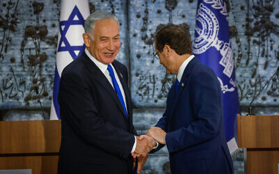 President Isaac Herzog (R) tasks Likud chief Benjamin Netanyahu with the mandate to form a new Israeli government, at the President's Residence in Jerusalem on November 13, 2022. (Olivier Fitoussi/Flash90)