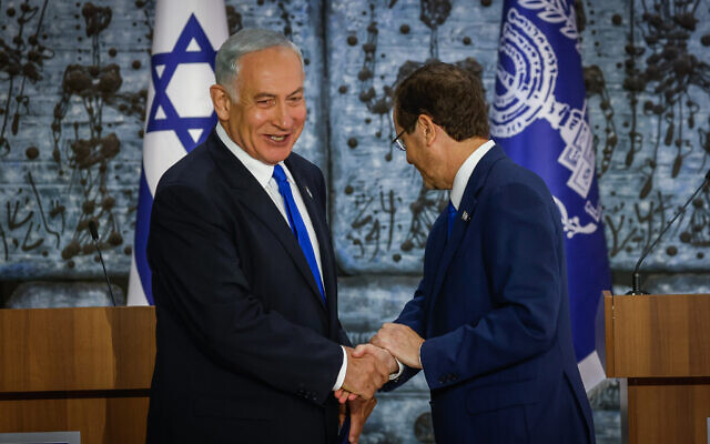 President Isaac Herzog (R) tasks Likud chief Benjamin Netanyahu with the mandate to form a new Israeli government, at the President's Residence in Jerusalem on November 13, 2022 (Olivier Fitoussi/Flash90)