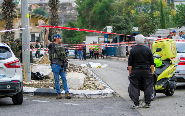 Israeli security and medics at the scene of a terror attack, at the entrance to Ariel industrial zone, in the West Bank, on November 15, 2022. (Nasser Ishtayeh/ Flash90)