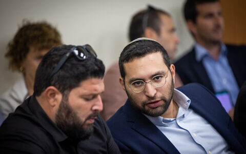 Otzma Yehudit's Almog Cohen (L) and Yitzhak Wasserlauf at the Knesset, November 21, 2022. (Yonatan Sindel/Flash90)