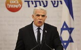 Prime Minister Yair Lapid speaks during his Yesh Atid party's faction meeting at the Knesset, November 21, 2022. (Yonatan Sindel/Flash90)