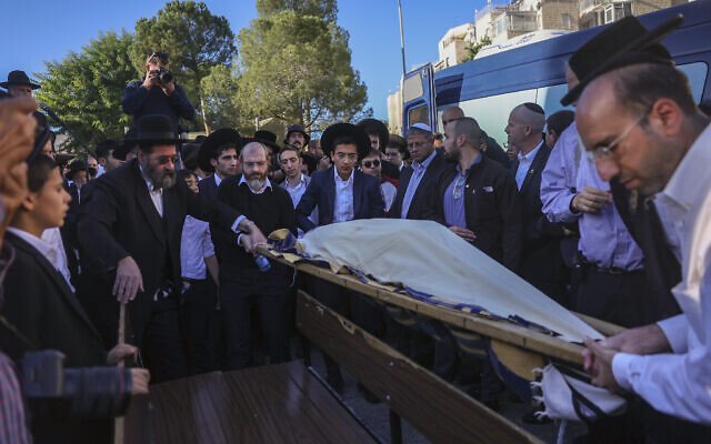 The funeral of Aryeh Schupak, 16, in the Jerusalem neighborhood of Har Nof, after a twin bombing terror attack at bus stops at entrances to Jerusalem on November 23, 2022. (Yonatan Sindel/Flash90)