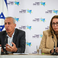 Health Ministry Director Prof. Nachman Ash (left) and Dr. Hadar Mizrahi hold a press conference about the Health Ministry's investigation into the case of a pregnant woman who was mistakenly inseminated with a fetus that was not genetically hers, near Tel Aviv, November 27, 2022. (Gideon Markowicz/Flash90)