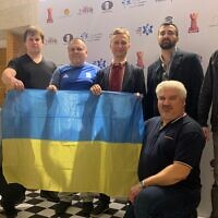 The Ukrainian chess team display some national pride at the World Teams Chess Championship 2022 in Jerusalem. (Courtesy of Oleksandr Sulypa)