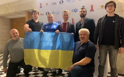The Ukrainian chess team display some national pride at the World Teams Chess Championship 2022 in Jerusalem. (Courtesy of Oleksandr Sulypa)