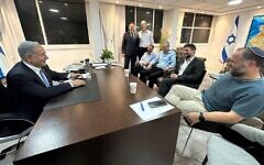 Likud party leader Benjamin Netanyahu, left, meets a Religious Zionism coalition negotiation team headed by party leader Bezalel Smotrich, second from right, in Jerusalem on November 27, 2022. (Likud/courtesy)