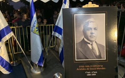A picture of Aristides de Sousa Mendes,  who is credited with saving thousands in the Holocaust, next to the square named in his honor, Kiryat Hayovel, Jerusalem, November 8, 2022 (Ash Obel/Times of Israel)