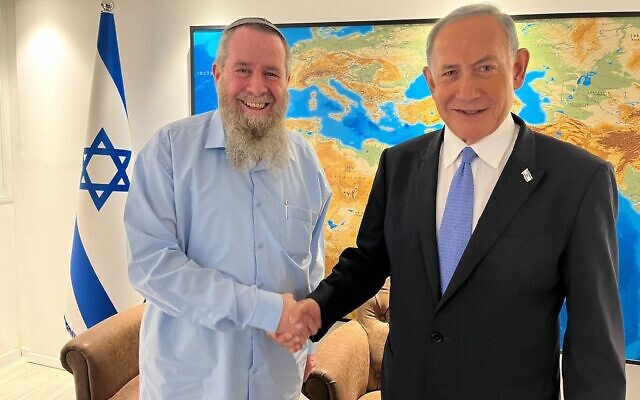 MK Avi Maoz, left, and Likud head Benjamin Netanyahu after agreeing to form a governing coalition on November 27, 2022. (Courtesy Likud)