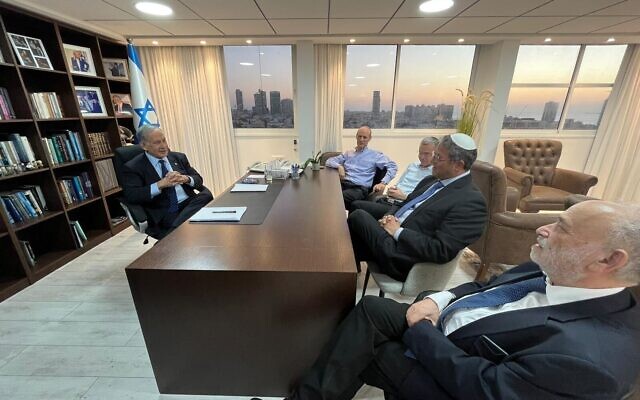 Likud chairman Benjamin Netanyahu (left) speaks to Otzma Yehudit leader Itamar Ben Gvir (second from right) for informal coalition talks at a Likud party office in Tel Aviv on November 7, 2022. (Courtesy)