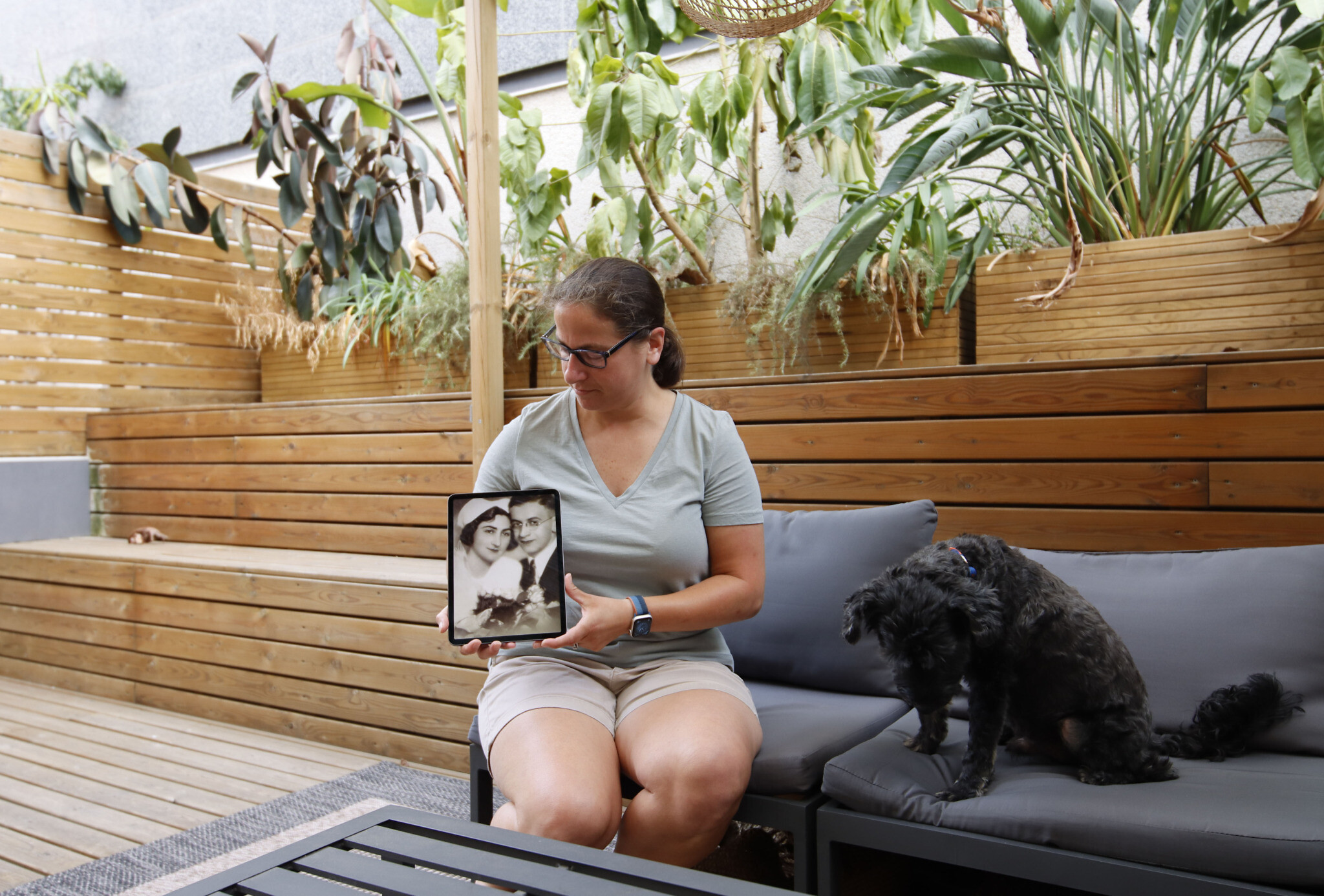 Julie Bronder displays an image of her maternal grandparents, Gertrude Klarman Kornblau and Aaron Kornblau, at her apartment in Barcelona, Spain, on June 20, 2022. They left Austria and arrived in the United States in July 1938. (Raquel G. Frohlich)