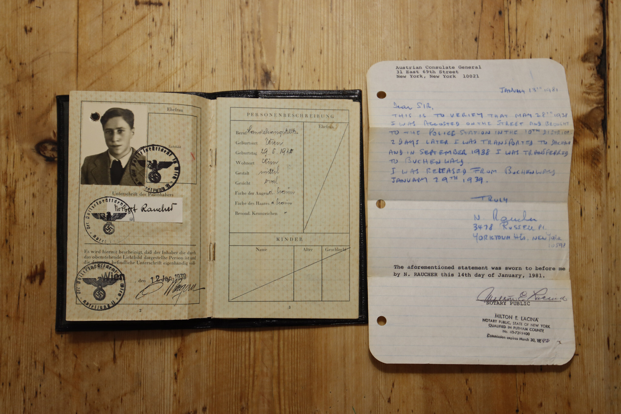 Documents belonging to Amy Feineman’s paternal grandfather, Norbert Raucher, at her home in Graz, Austria, on June 27, 2022. He was deported to Dachau and then later to Buchenwald before escaping to England with the help of his sister in 1939. (Raquel G. Frohlich)