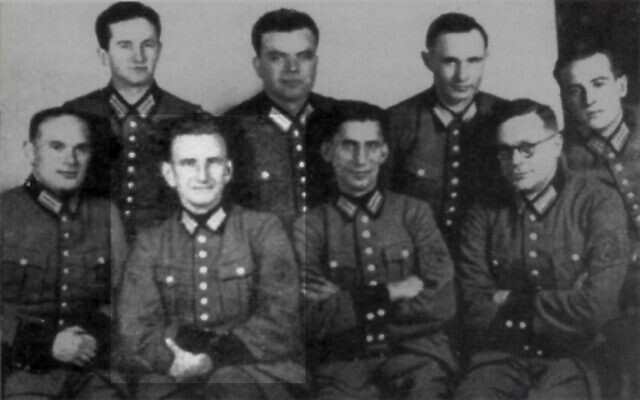 Ukrainian Nazi German Schutzmannschaft Battalion 201 with Roman Shukhevych (sitting, second from left), 1942. (PD via Wikimedia)