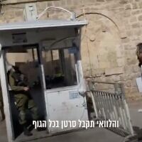 A screenshot from a video of an IDF soldier cursing an activist from the left-wing Breaking the Silence group at a checkpoint in the West Bank City of Hebron, November 16, 2022. (Twitter screenshot: used in accordance with Clause 27a of the Copyright Law)