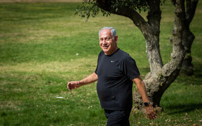 Likud leader Benjamin Netanyahu during a morning walk on the morning after elections, November 2, 2022. (Yonatan Sindel/Flash90)