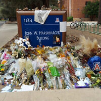 A memorial for University of Arizona professor Thomas Meixner outside the school's Department of Hydrology and Atmospheric Sciences building in Tucson, Arizona, October 14, 2022. (AP Photo/Terry Tang)