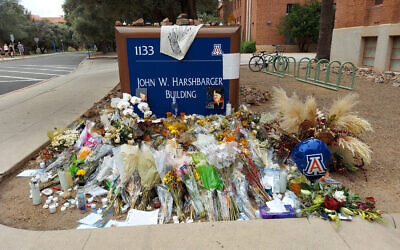 A memorial for University of Arizona professor Thomas Meixner outside the school's Department of Hydrology and Atmospheric Sciences building in Tucson, Arizona, October 14, 2022. (AP Photo/Terry Tang)