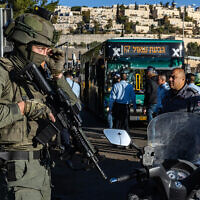 Police and security personnel at the scene of a terror attack in Jerusalem, on November 23, 2022. (Olivier Fitoussil/Flash90)
