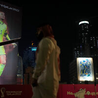 A giant poster depicting Germany's goalkeeper Manuel Neuer covers a skyscraper ahead of the World Cup in Doha, Qatar, November 18, 2022. (AP Photo/Thanassis Stavrakis)