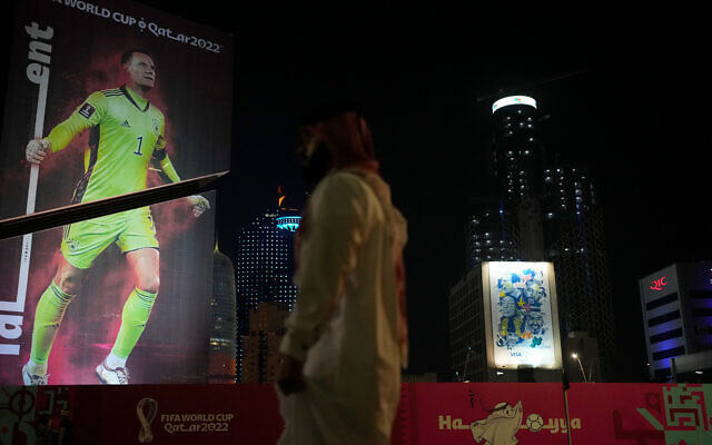 A giant poster depicting Germany's goalkeeper Manuel Neuer covers a skyscraper ahead of the World Cup in Doha, Qatar, November 18, 2022. (AP Photo/Thanassis Stavrakis)